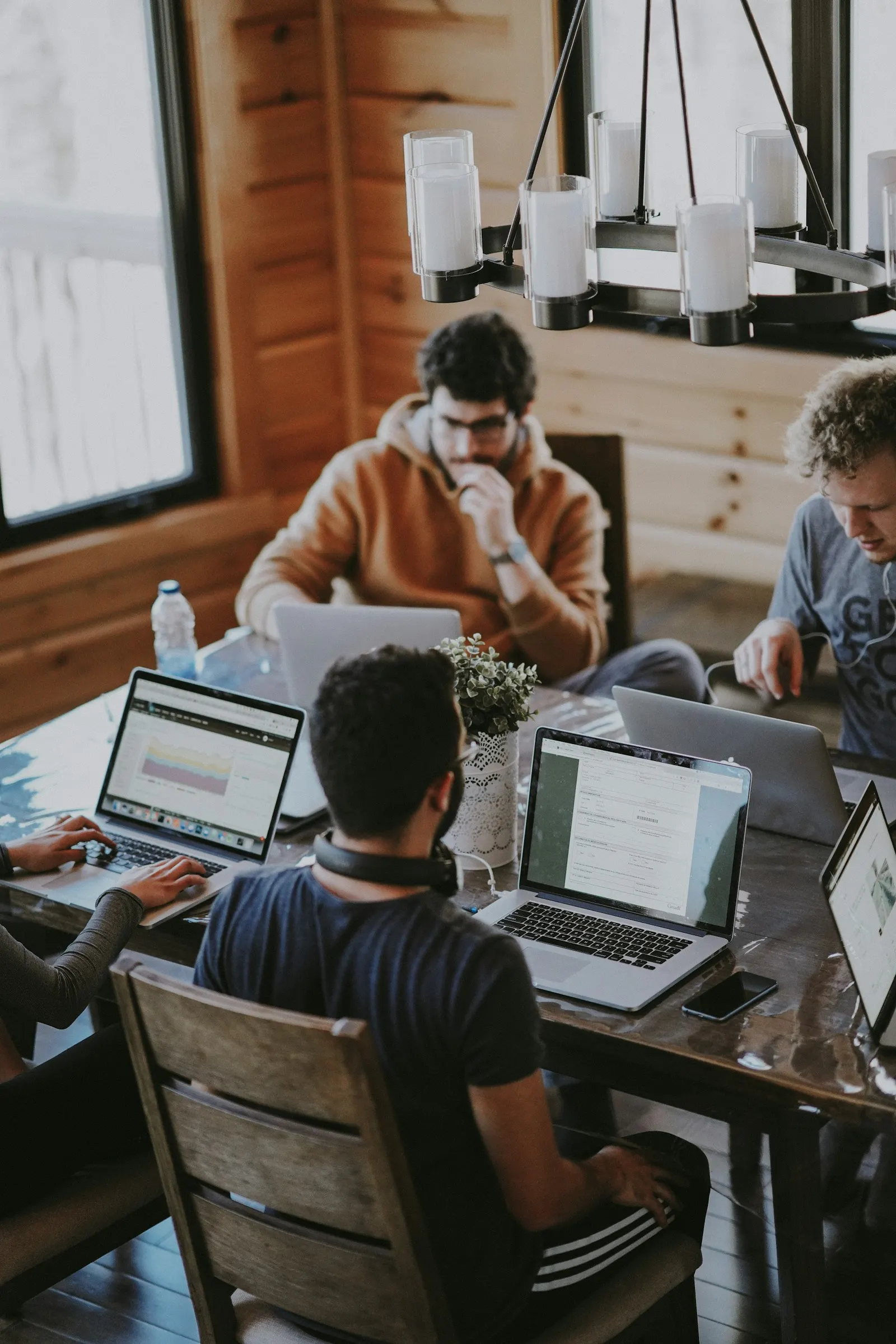 People working together at laptops